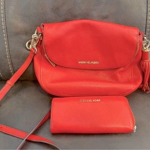 Michael Kors coral Crossbody with tassel and matching clutch wallet